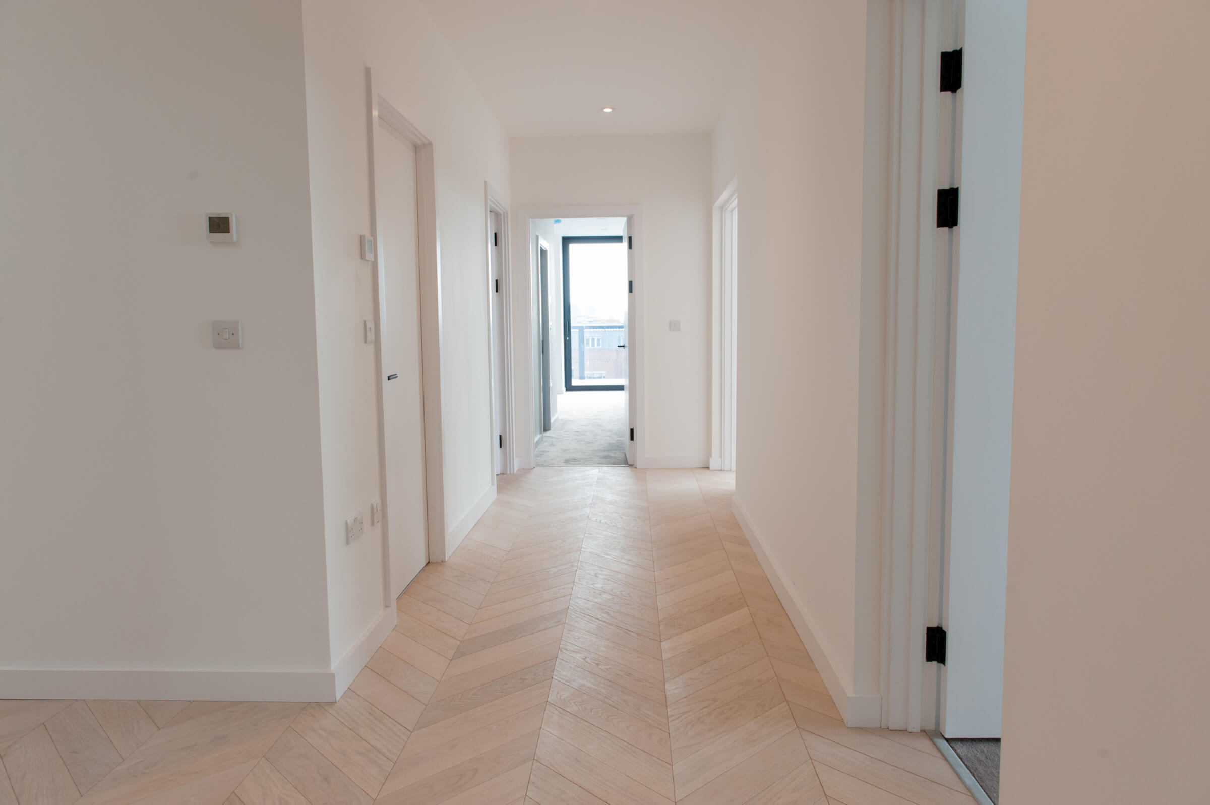 Hall and view towards master bedroom apartment 11 penthouse