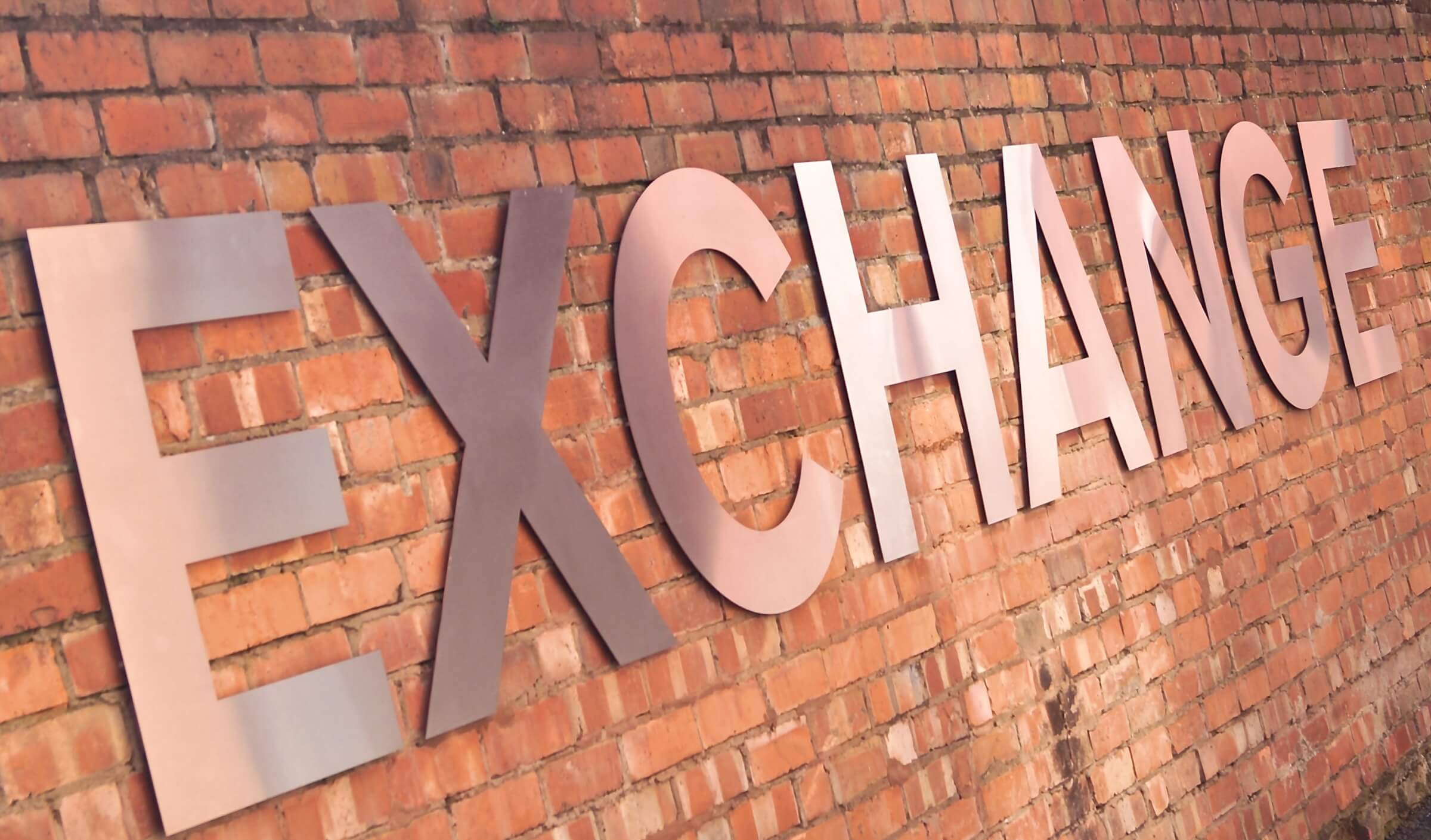 The Exchange Logo on wall.